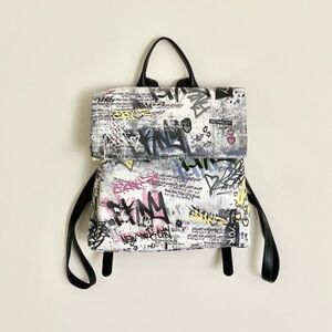 DKNY Tilly Graffiti Mid Top Zip Faux Leather Backpack.